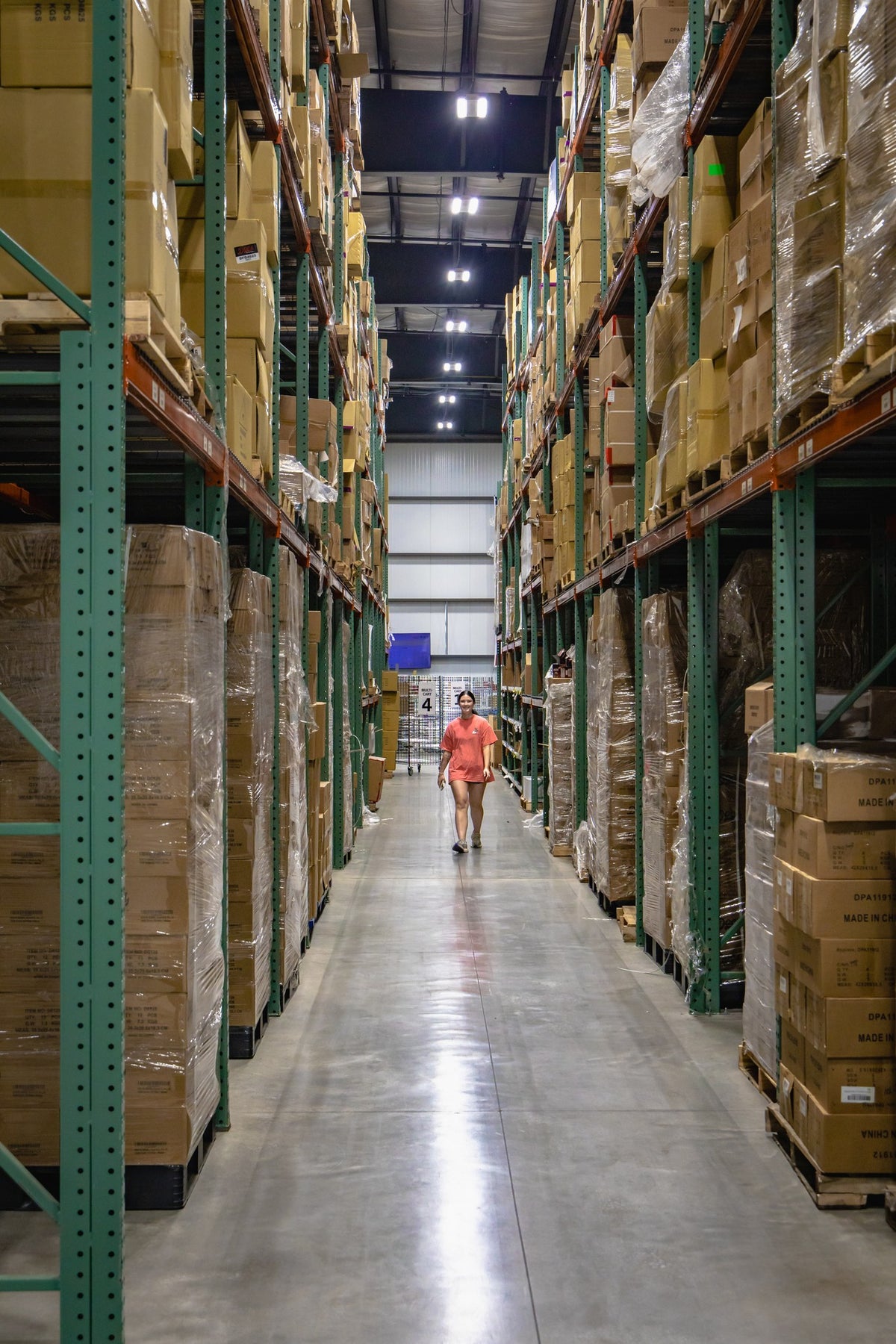 A long aisle of fully stocked racking in the Doc's Diesel warehouse in Bryan, Ohio