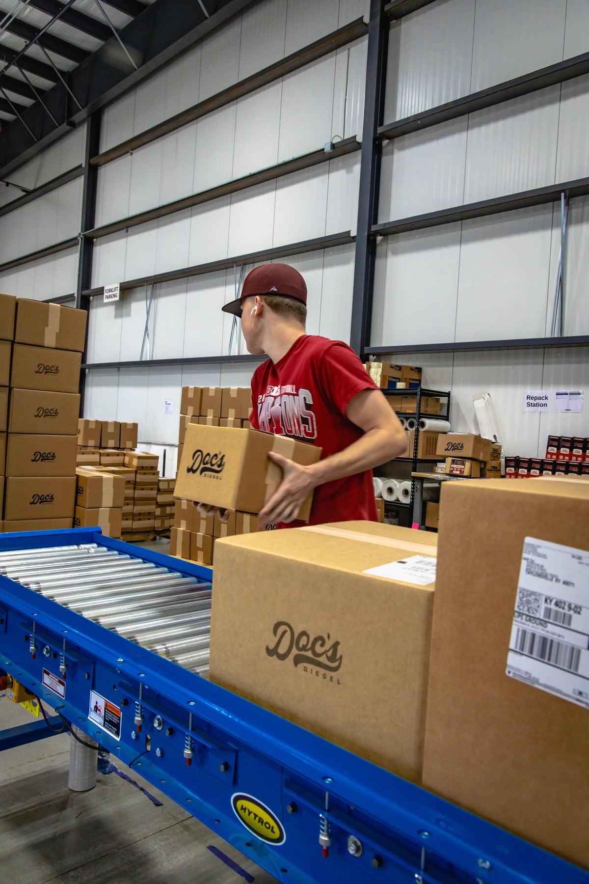 Doc's Diesel order boxes moving down the packing conveyor