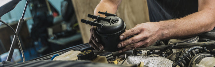 Mechanic Replacing Fuel Filter with Doc's Diesel Fuel Filter