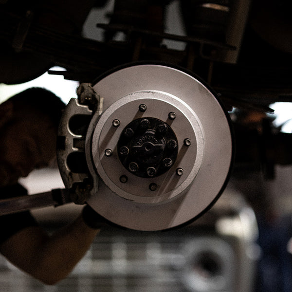 Doc's Diesel High Carbon Brake Rotors being placed on to a car lifestyle