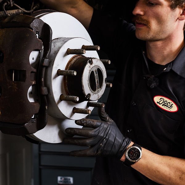 Doc's Diesel High Carbon Brake Rotors being placed on to a car lifestyle