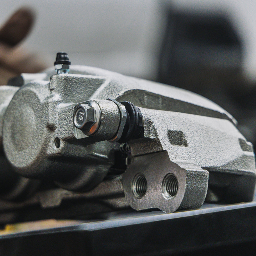 Close-up of the zinc-plated finish on a Doc's Diesel brake caliper