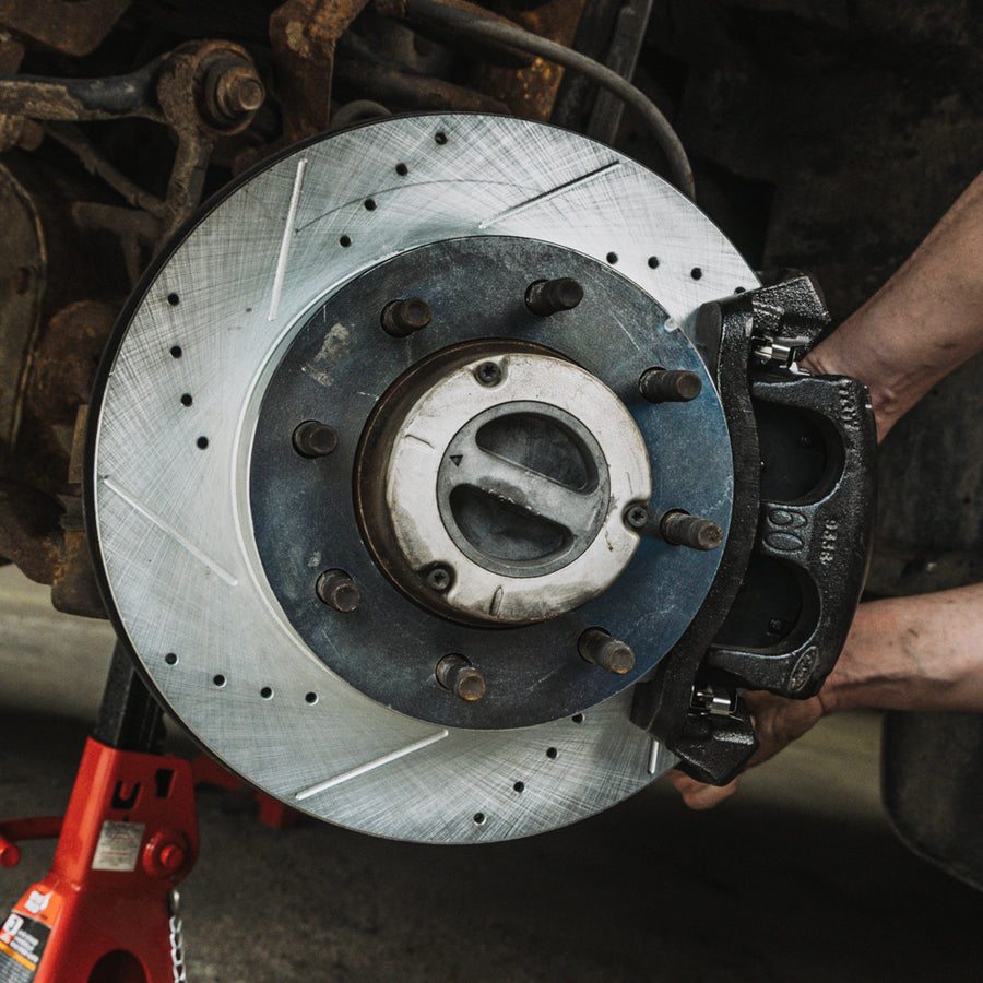 Close-up of a drilled and slotted diesel truck brake rotor