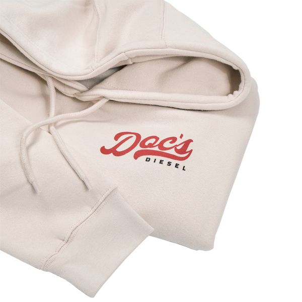 Doc's Staple Hoodie Tan logo closeup