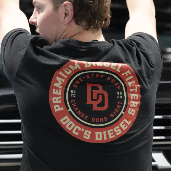 Doc's Diesel Shop T-Shirt Black back view on a mechanic